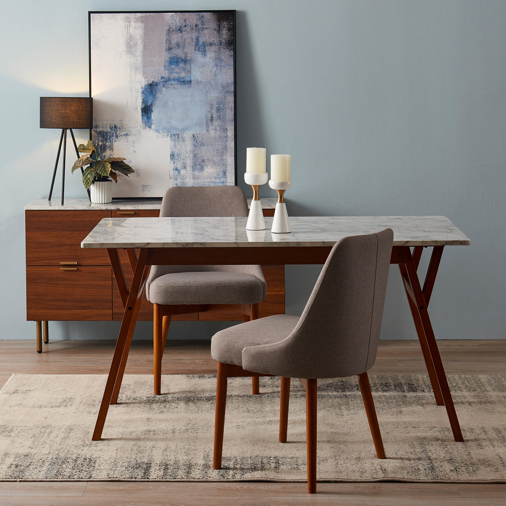 A Teamson Home Ashton Rectangular Marble-Look Dining Table with Wood Base, Marble/Walnut with two chairs and a painting.