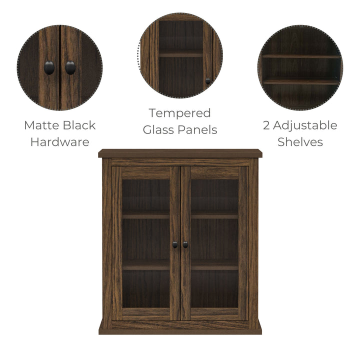 Infographic for a walnut finished two-door wall cabinet pointing out the matte black hardware, tempered glass panels and two adjustable shelves.