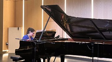 Image for Music conductor of a children's orchestra in a classroom