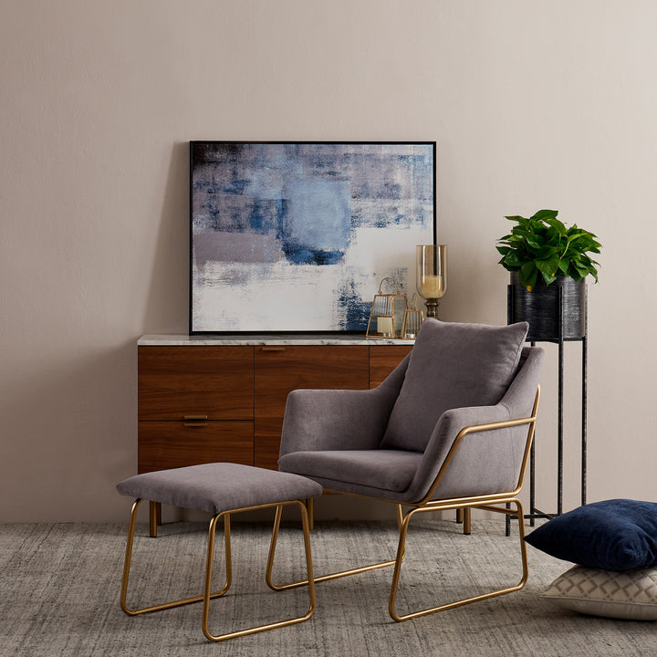 Miller gray armchair and ottoman with gray fabric and gold framework.