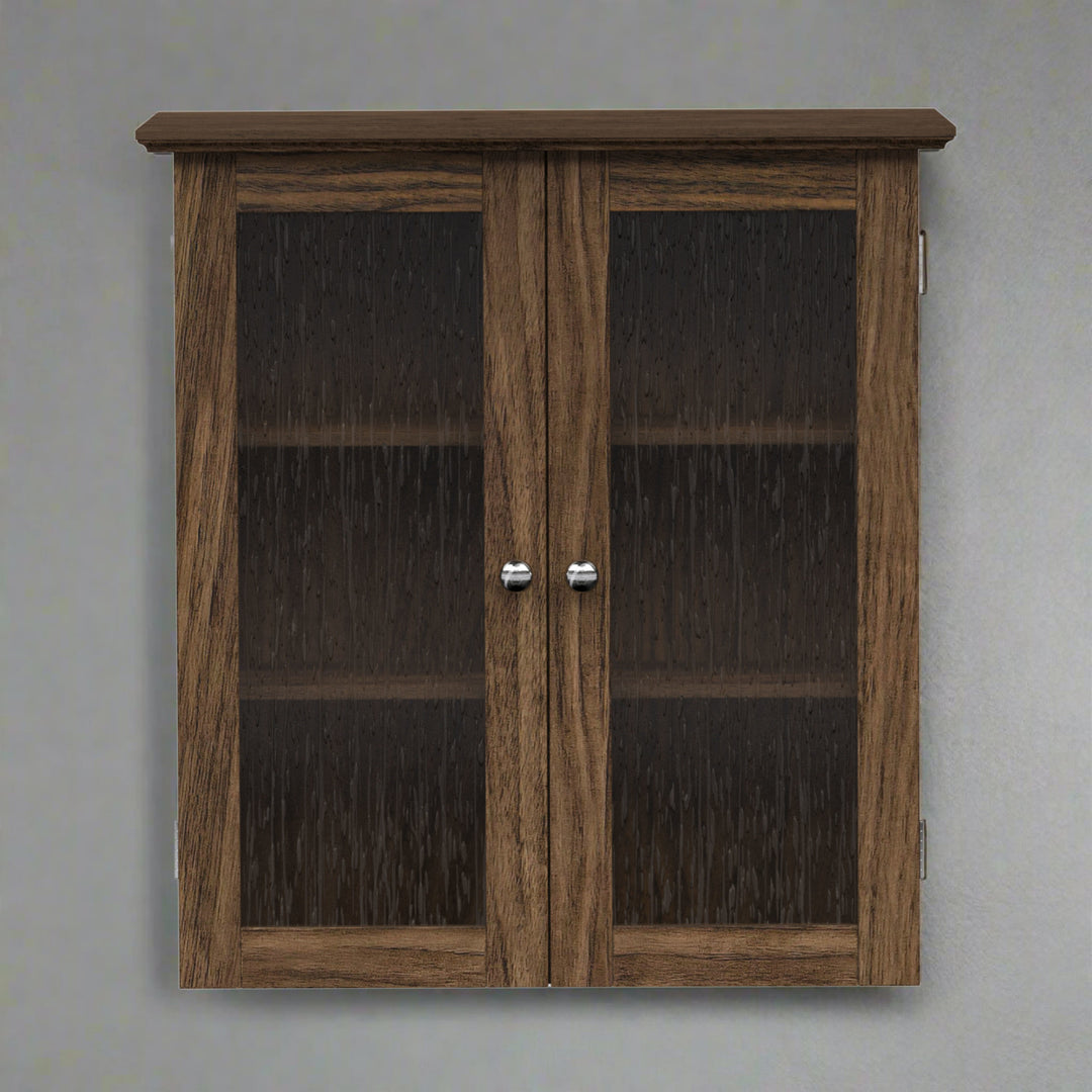 Walnut finished wall cabinet with two glass paneled doors on a gray wall.