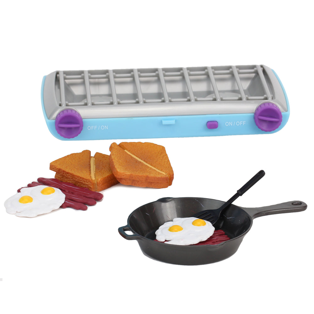 A camp stove and food set for 18" dolls, including a 2 sandwiches, bacon and eggs, a faux cast iron pan, a spatula, and a blue camp stove with purple dials.