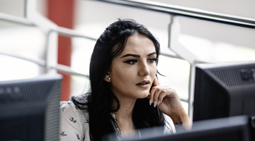 Image for A student working on a computer in Tallaght Library