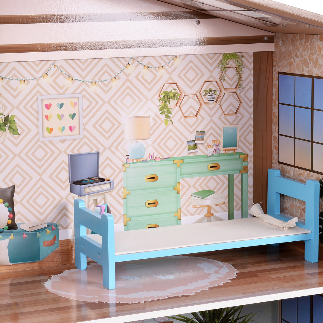 A close-up of the bedroom with the white and gold wall panel and blue bed.