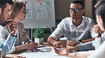 Image for Discussing ideas around a desk