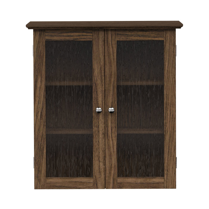 Walnut finished wall cabinet with two glass paneled doors.