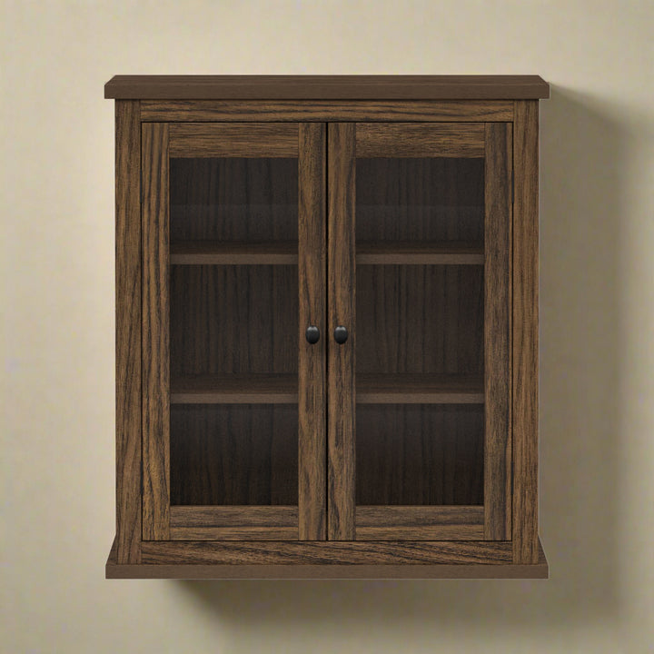 Two-door walnut finished wall cabinet hung on a tan wall.