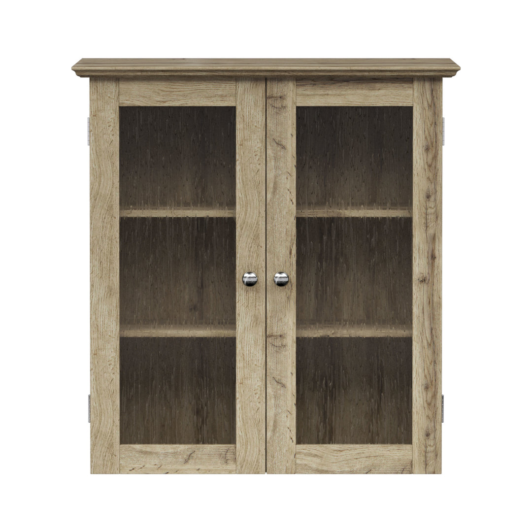 Light Oak finished 2-door cabinet with two shelves and glass panel doors.