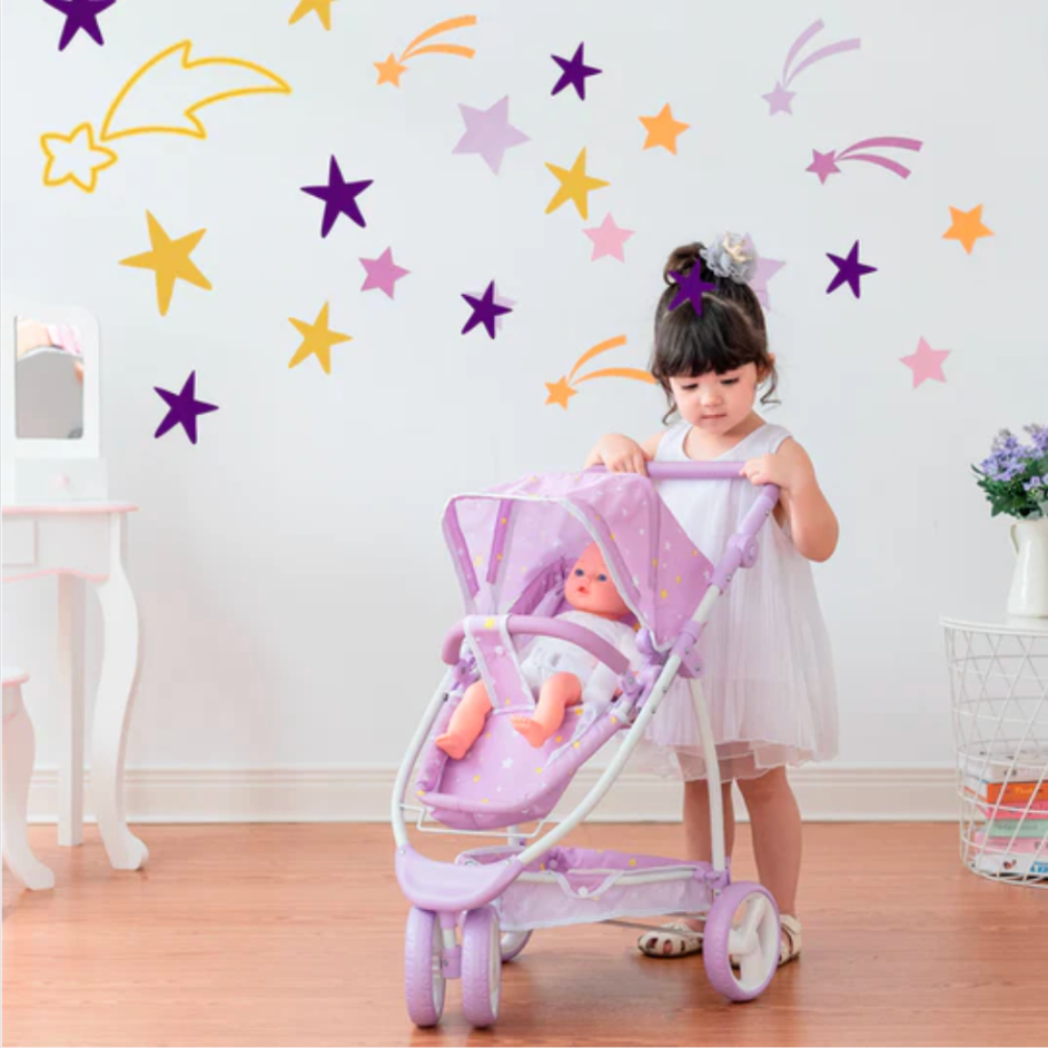 Little girl pushes a purple stroller with a baby doll sitting inside. 